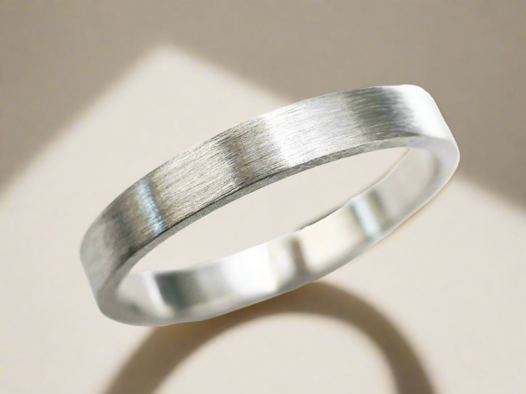 minimalist matte brushed platinum ring with straight flat band for wedding or everyday wear