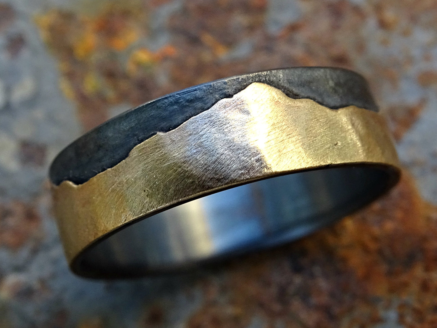 Solid 14k gold and dark silver mountain ring with engraved customizable mountain design and comfort fit band