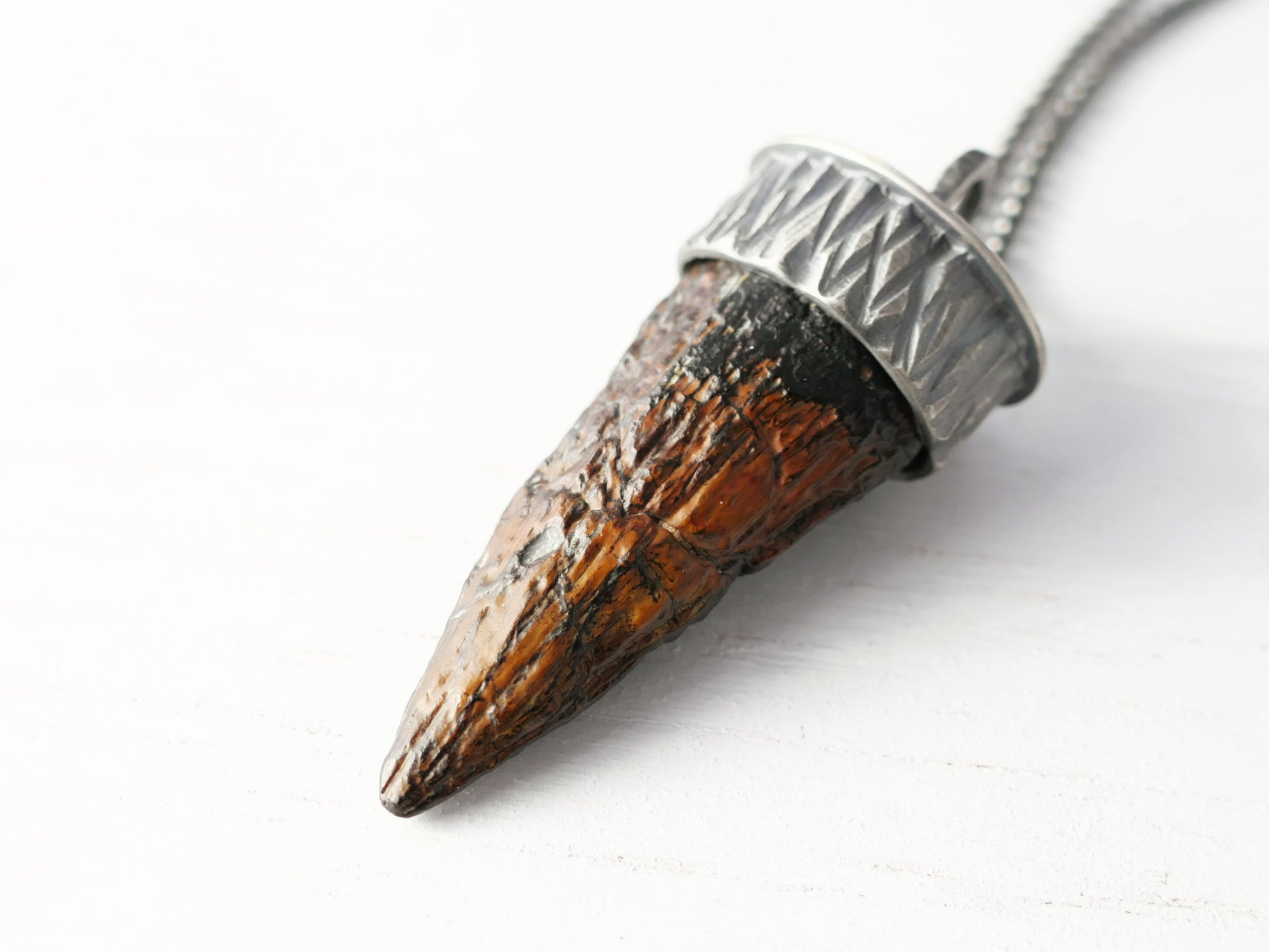 Real fossilized Suchomimus dinosaur tooth pendant set in handcrafted sterling silver necklace