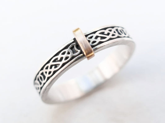 slim sterling silver Celtic knot ring with bronze accent strip and intricate pattern