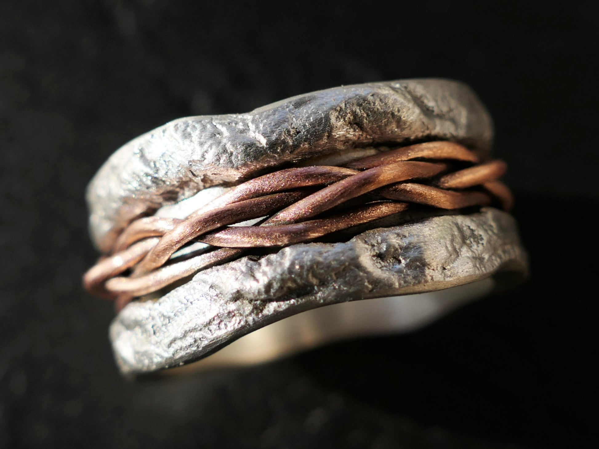 Large sterling silver ring with darkened copper woven inlay and textured oxidized finish