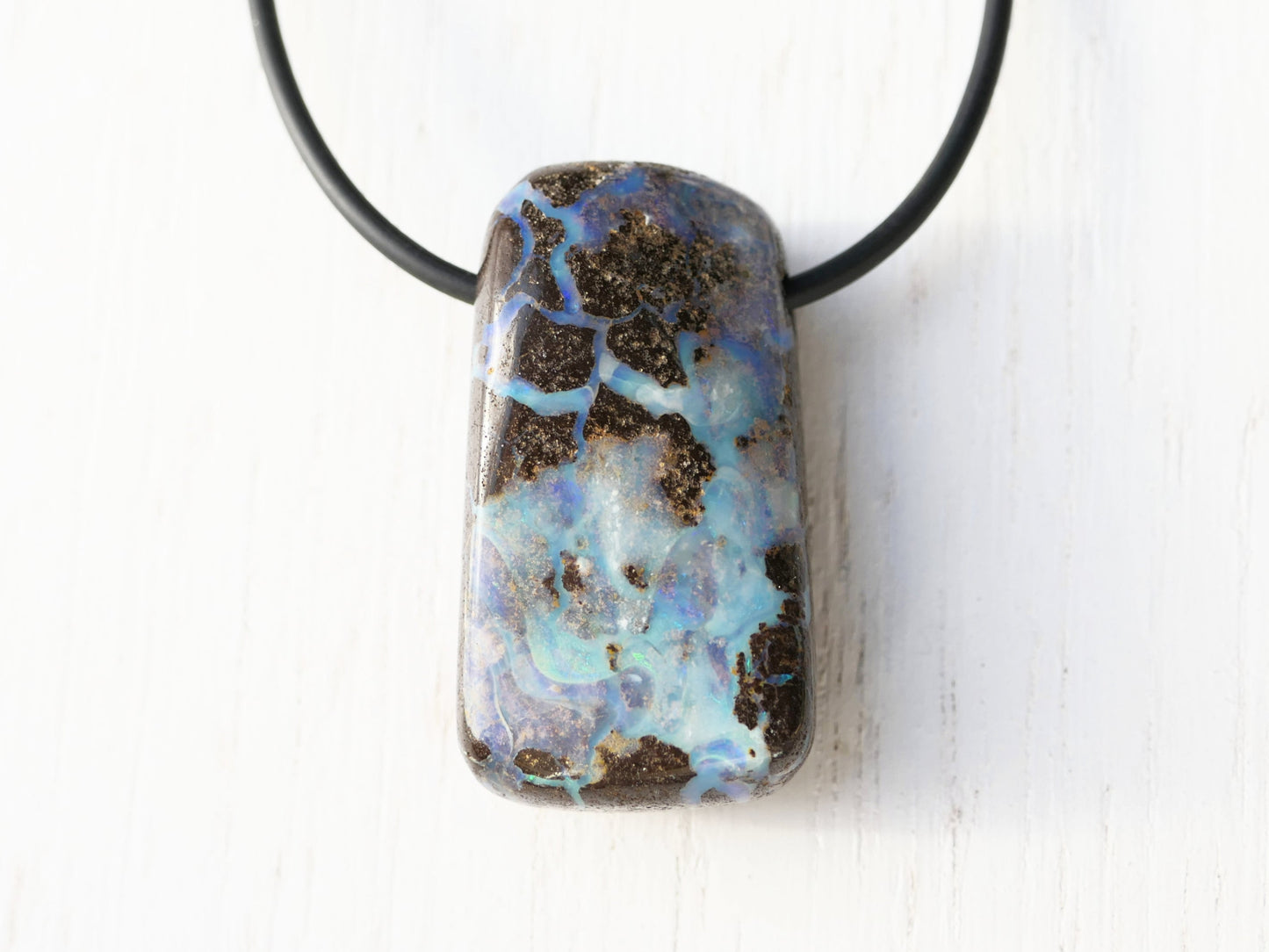 Chunky boulder opal pendant on black neoprene cord with sterling silver clasp.