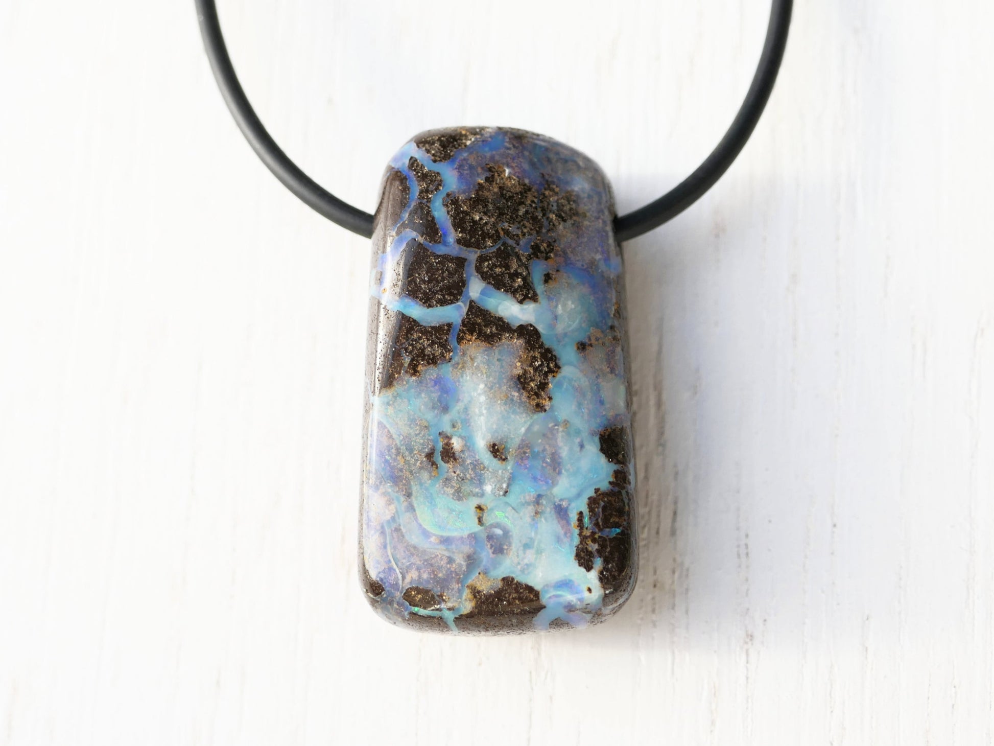 Chunky boulder opal pendant on black neoprene cord with sterling silver clasp.