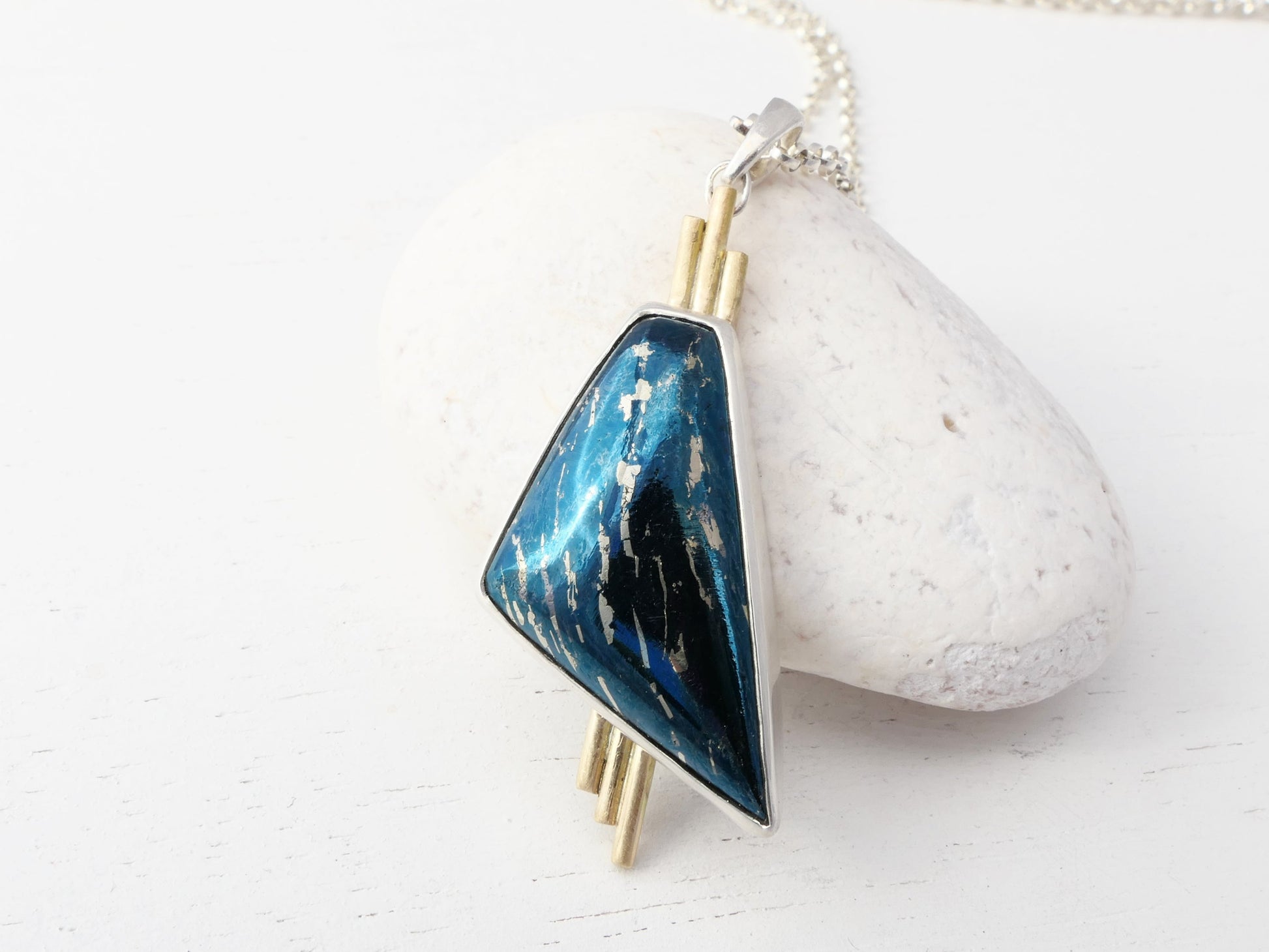Handcrafted 14k gold and sterling silver covellite pendant with midnight blue color change gemstone on sterling silver chain