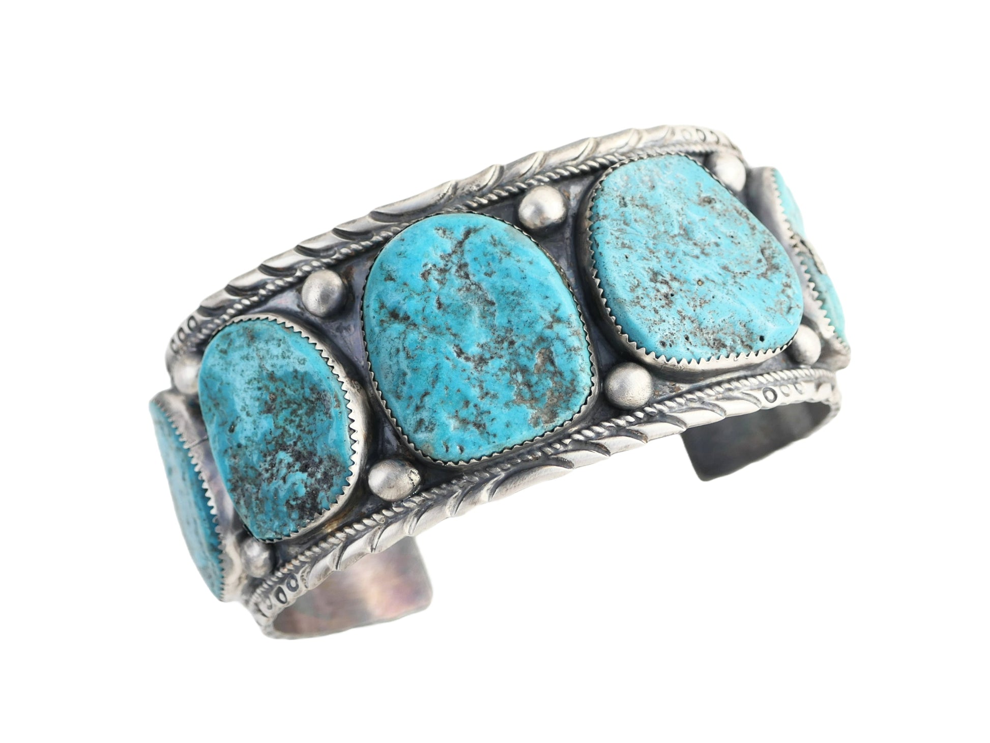 Wide men's turquoise cuff bracelet with Kingman gemstones in Navajo silver design.