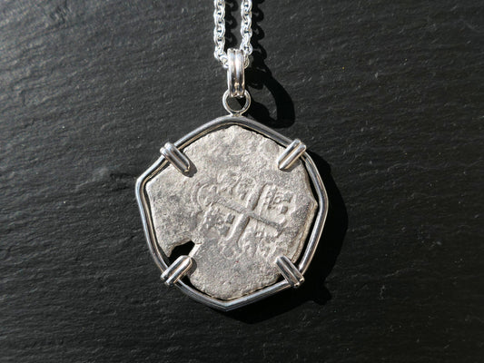 Spanish colonial silver treasure coin necklace with authentic coin from 1572-1734, in sterling silver setting.