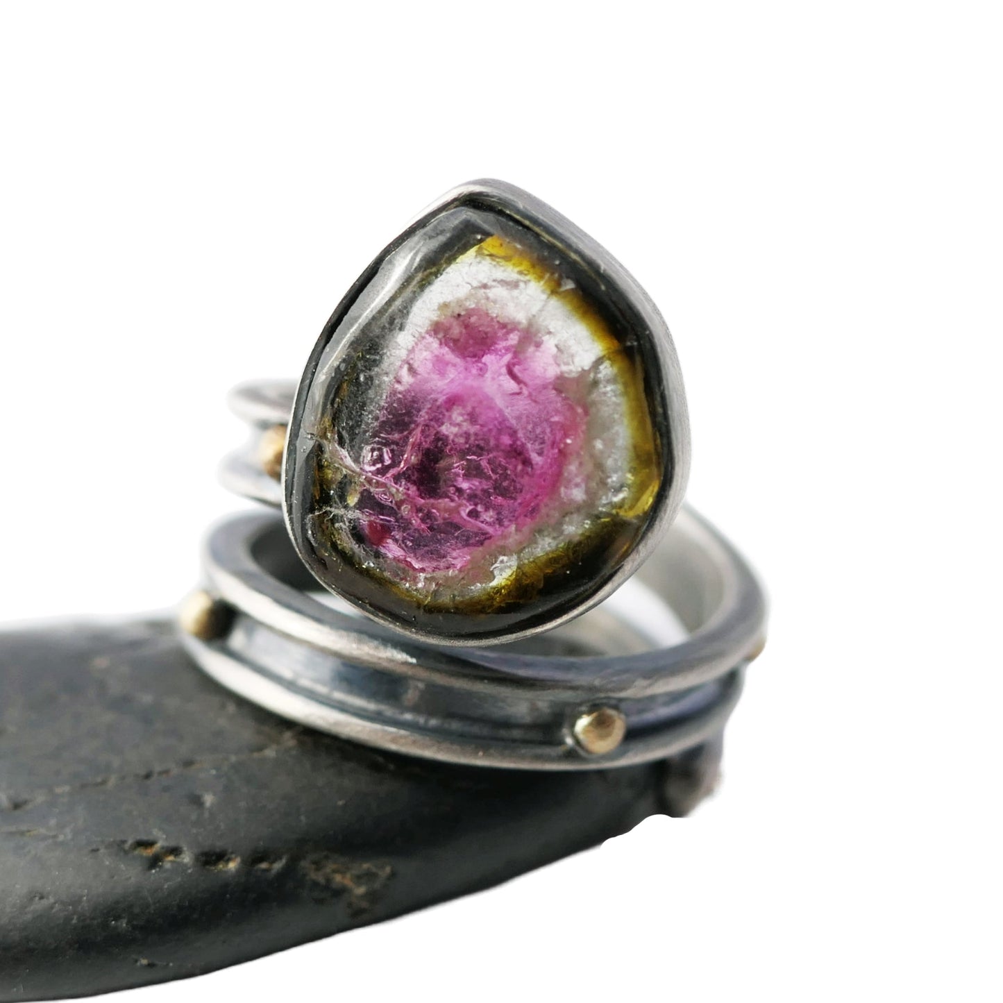 Sterling silver adjustable watermelon tourmaline ring with pink, green, and clear gemstone in bezel setting on oxidized band with brass granules