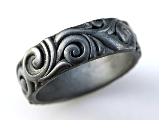 sculptural black sterling silver ring with carved scroll and swirl nature-inspired design