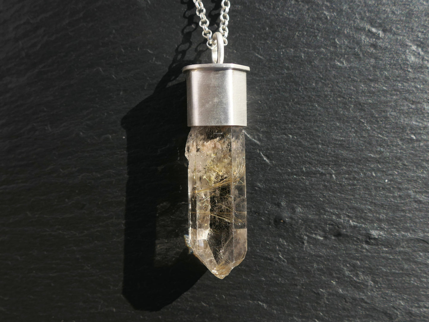 Golden Rutile in Smoky Quartz crystal necklace with sterling silver setting.