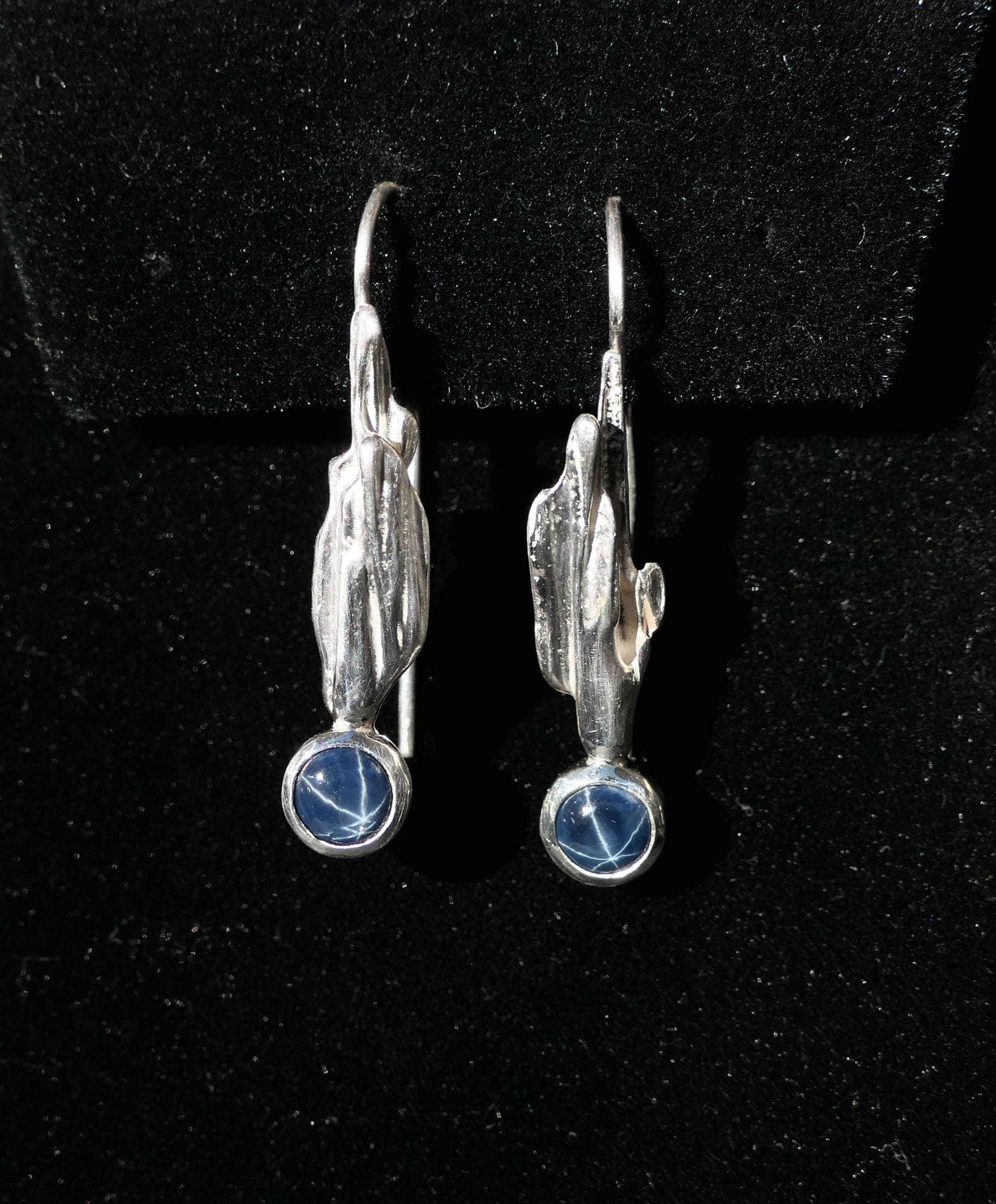 Handmade blue star sapphire earrings made from reclaimed sterling silver.