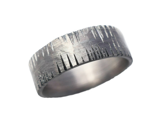 unique men's wedding ring in dark oxidized sterling silver with hammered surface and carved details
