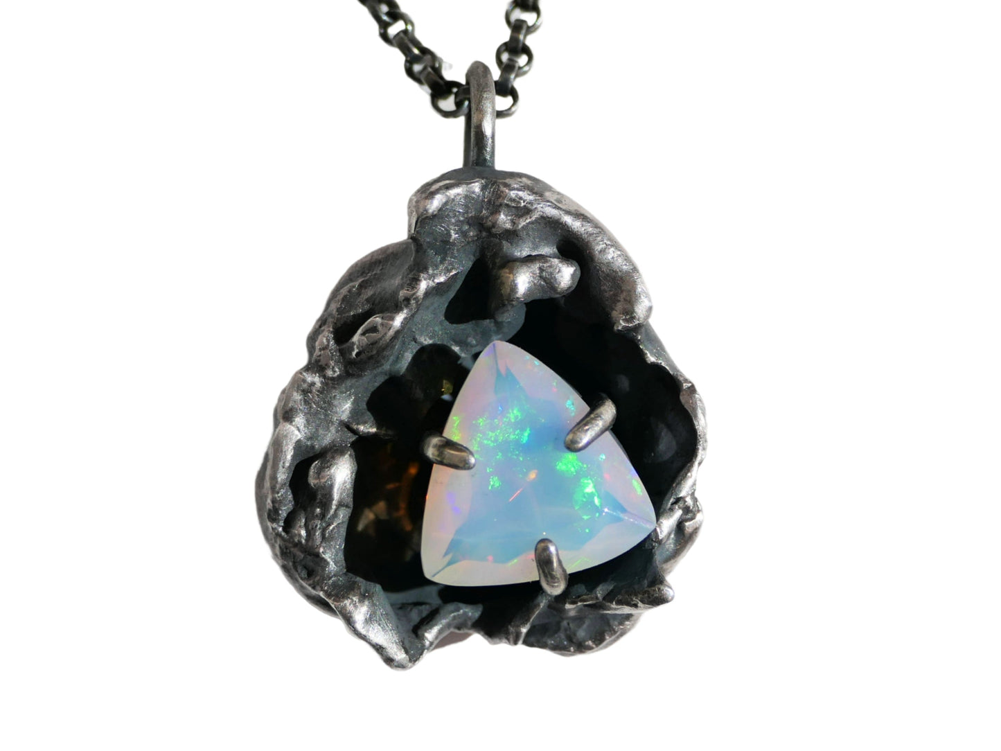 Darkened silver watercast pendant featuring a trillion-shaped Welo opal on black sterling silver chain