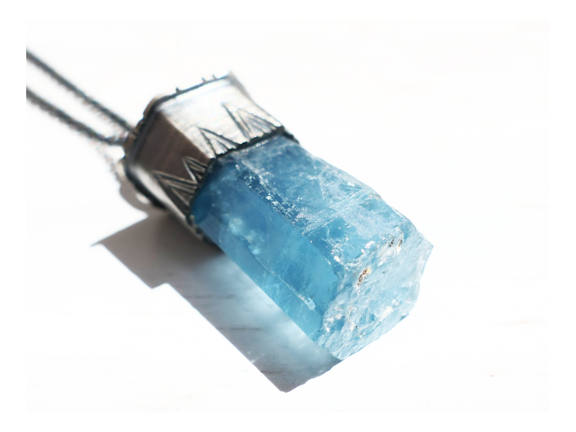 Vietnam aquamarine crystal pendant necklace in dark silver setting on chain