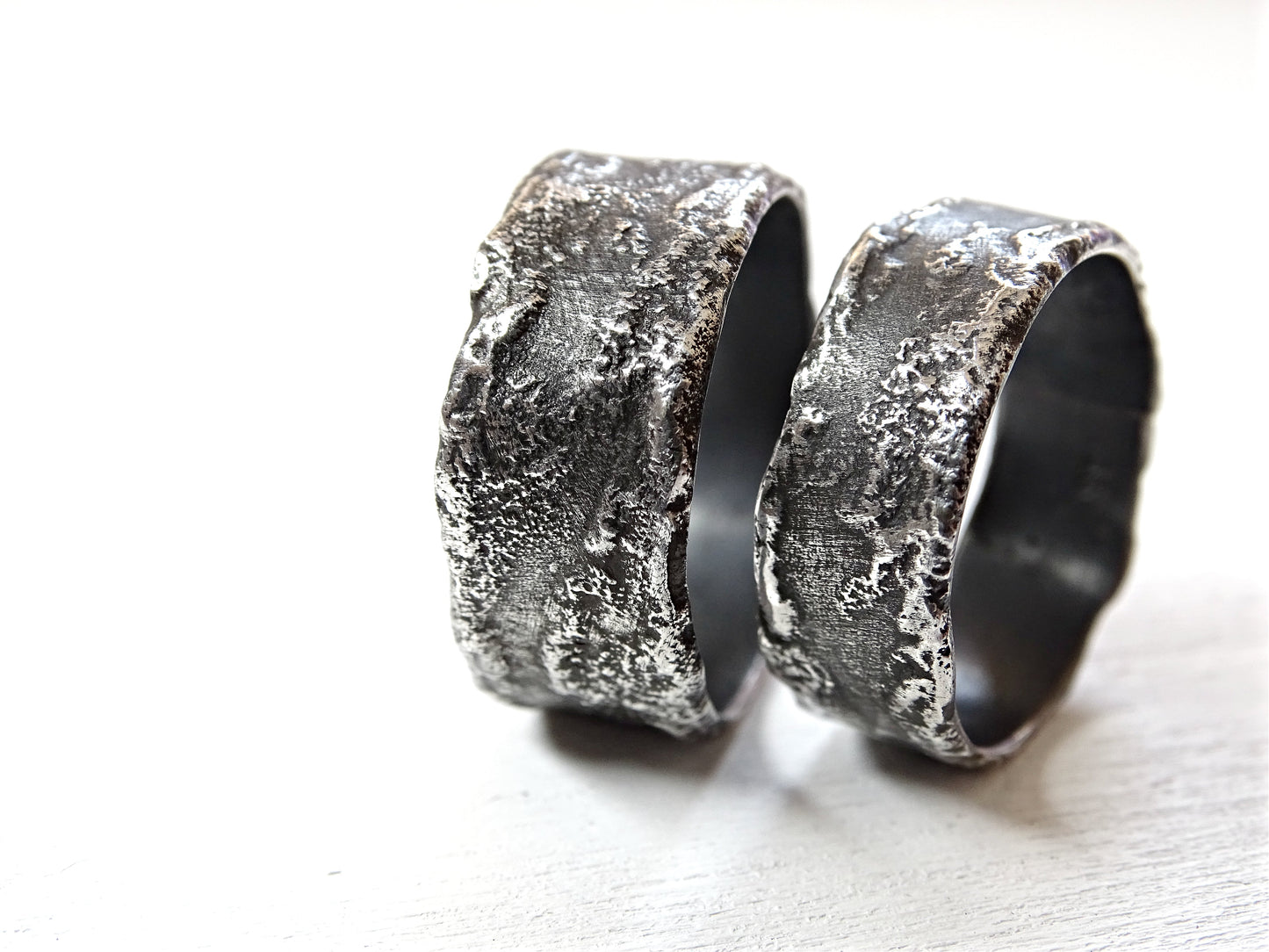 unique handmade dark silver wedding ring set with textured oxidized surface