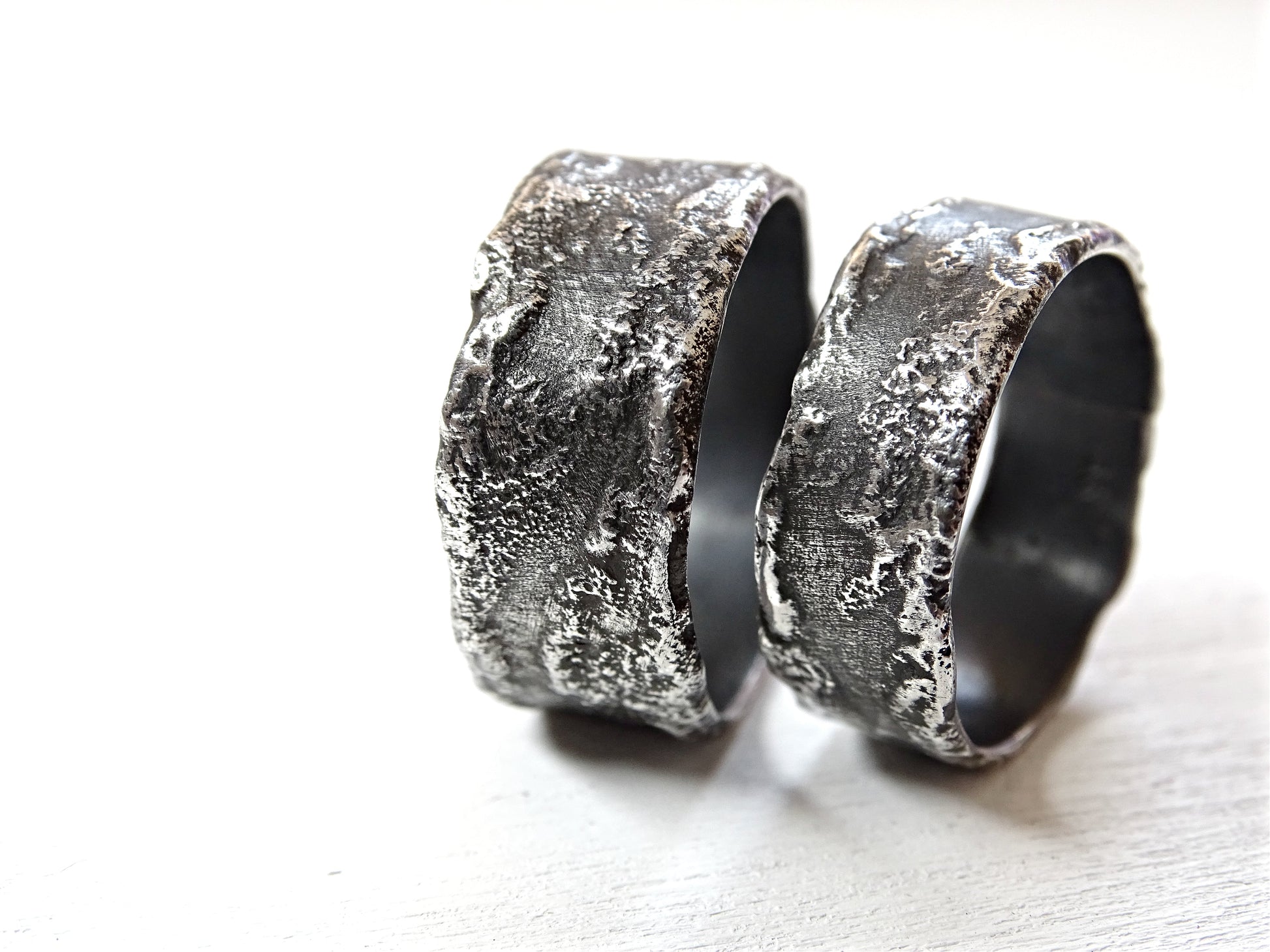 unique handmade dark silver wedding ring set with textured oxidized surface