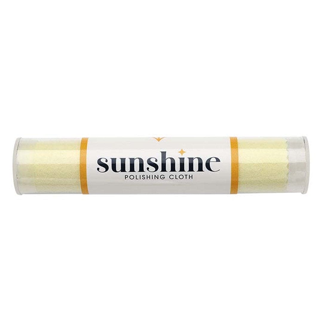 Sunshine jewelry polishing cloth in a protective tube for removing tarnish and grime from jewelry and other surfaces.