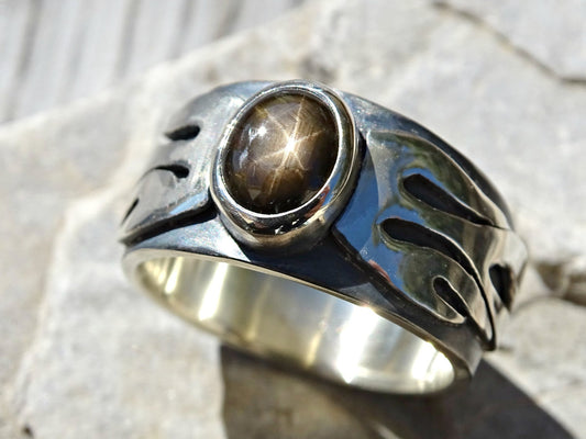 Men's black star sapphire ring with sterling silver flame design and oval cabochon gemstone
