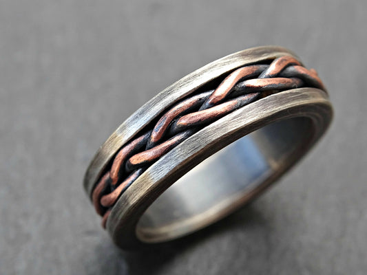 Dark silver braided wedding band with copper inlay, hand forged sterling silver ring.