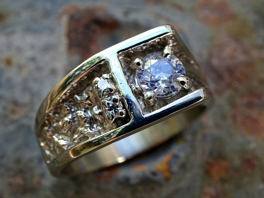 men's white gold diamond ring with 0.66 carat center stone and two smaller diamonds on a solid 14k band