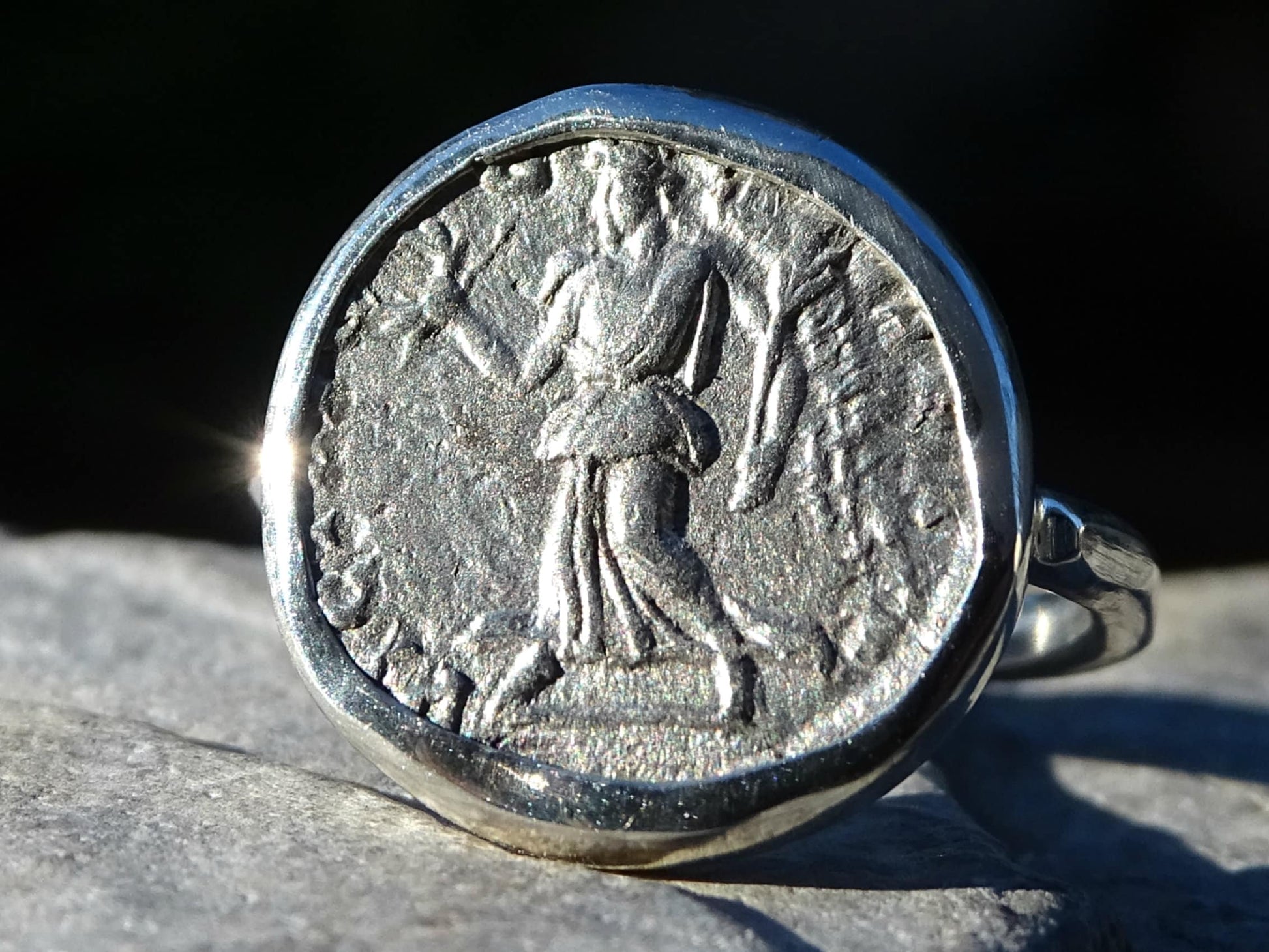 Sterling silver coin ring featuring ancient Roman coin with goddess Victoria and Emperor Septimius Severus bust