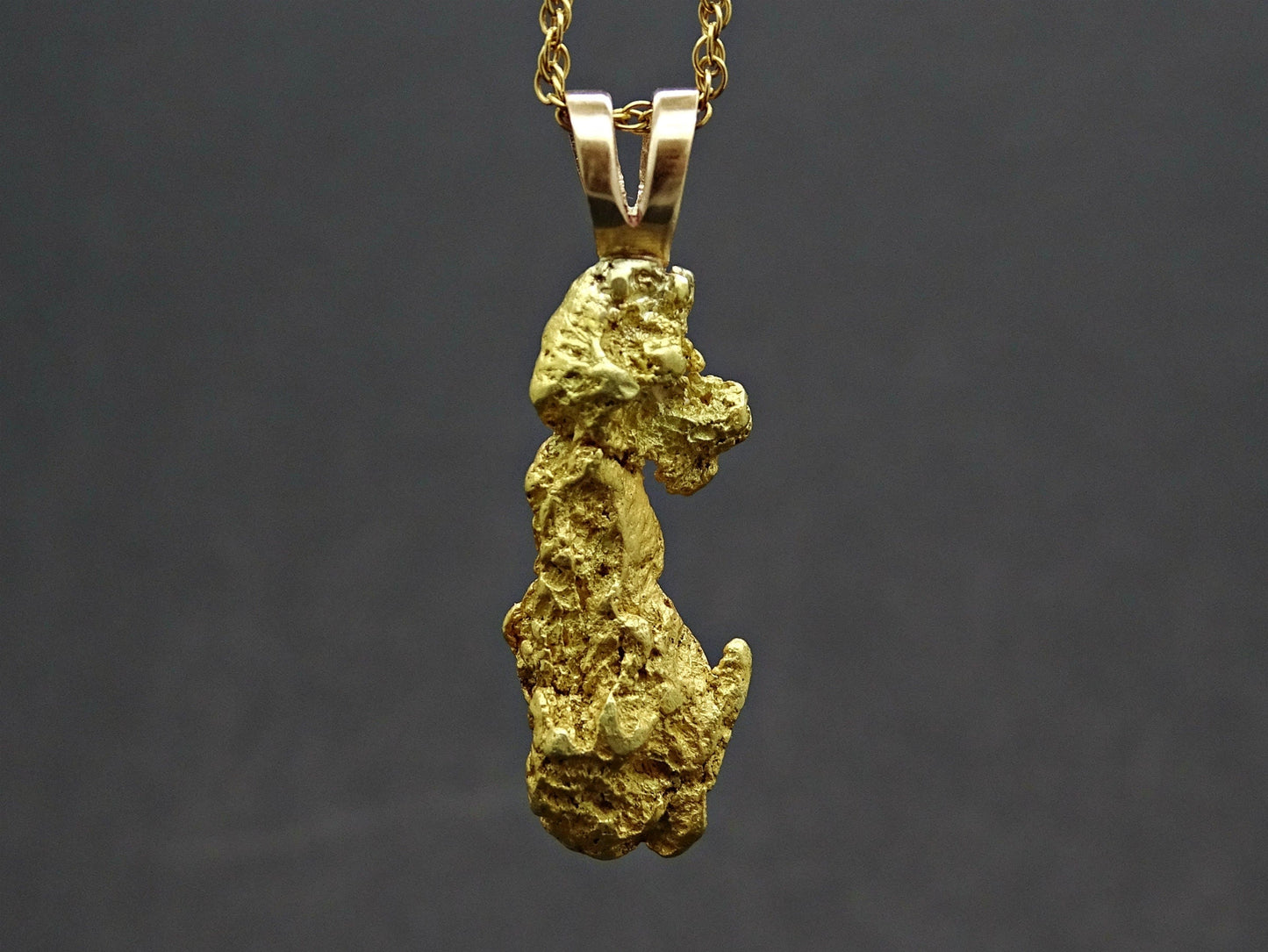 Natural Alaska gold nugget pendant on gold-filled chain with 22k purity and raw textured surface
