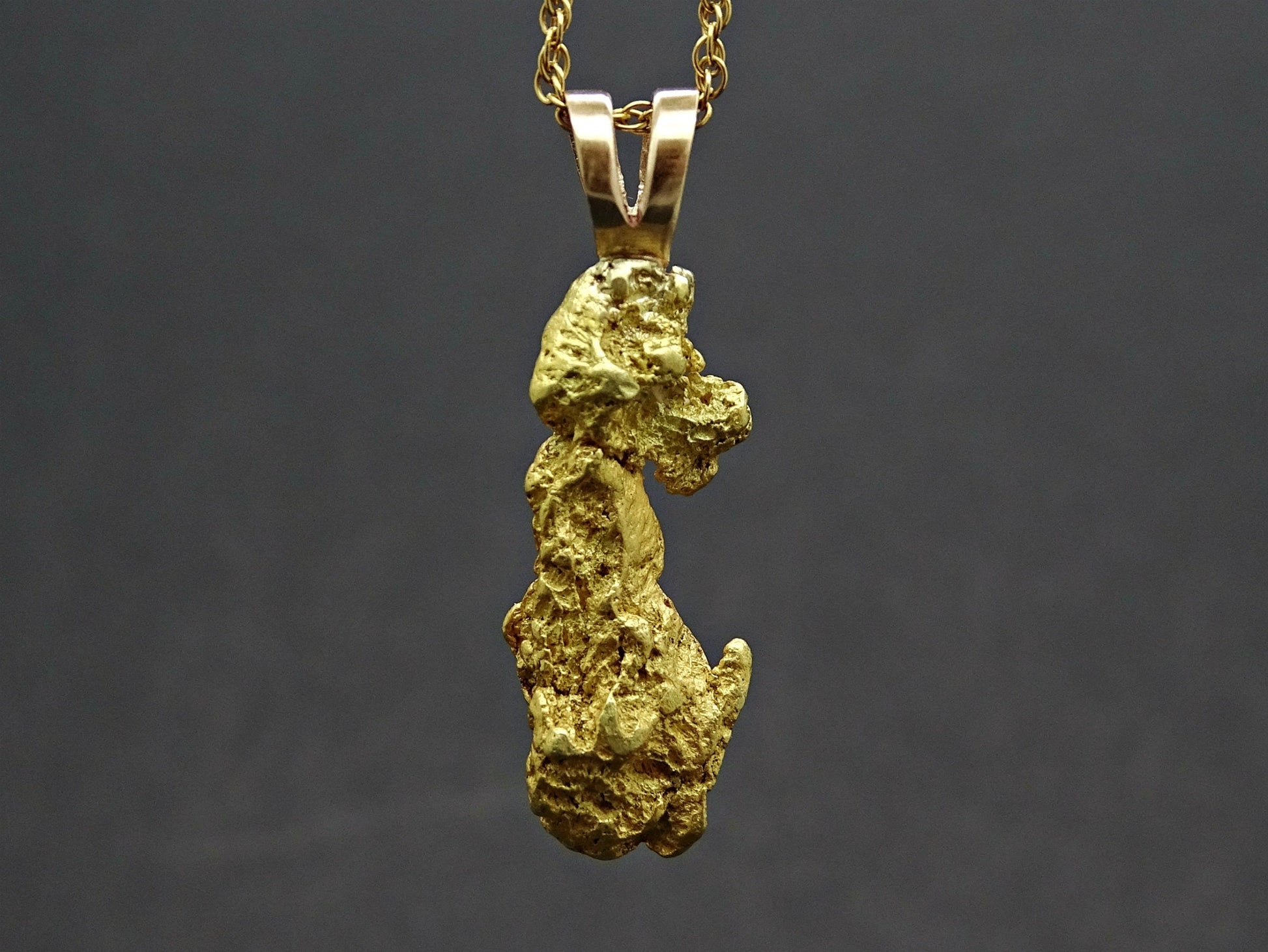 Natural Alaska gold nugget pendant on gold-filled chain with 22k purity and raw textured surface