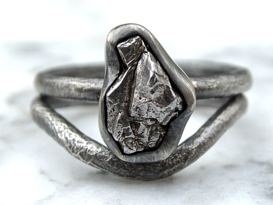 Meteorite engagement ring with irregular Campo del Cielo iron meteorite set in molten sterling silver band