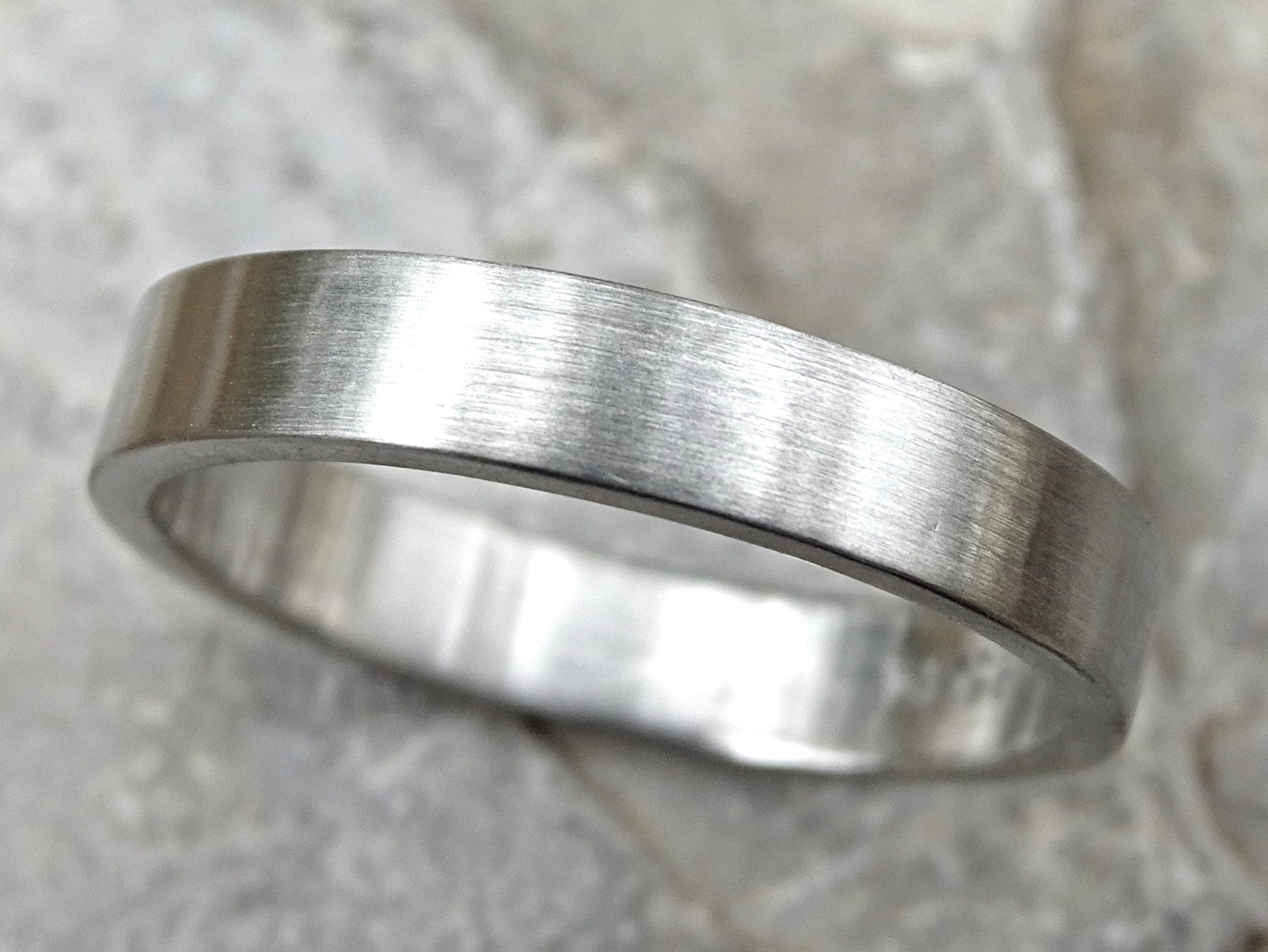 Minimalist matte brushed palladium ring with flat band, scratch-resistant and made from recycled solid palladium.