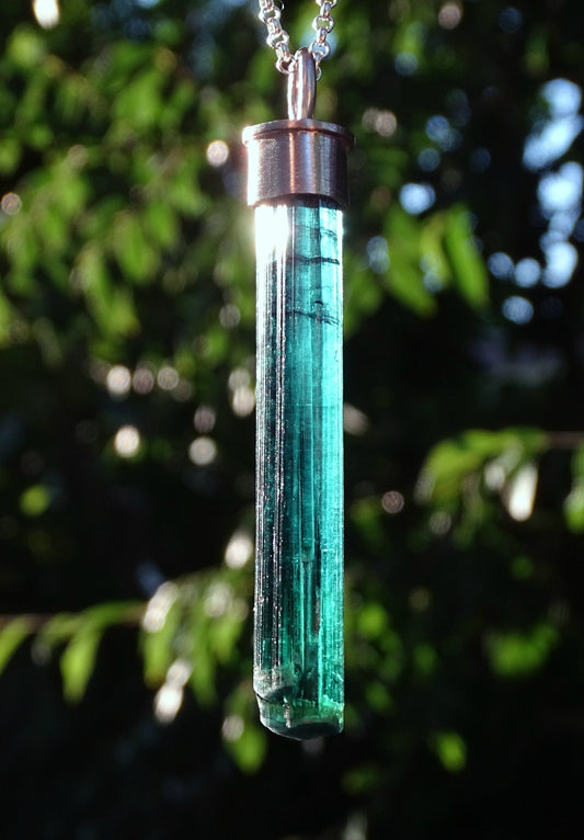 large indicolite tourmaline crystal pendant in 14k white gold with sterling silver chain