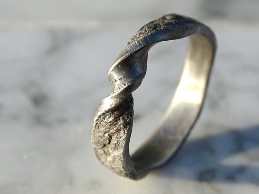 unique black silver molten infinity ring with twisted design and textured finish
