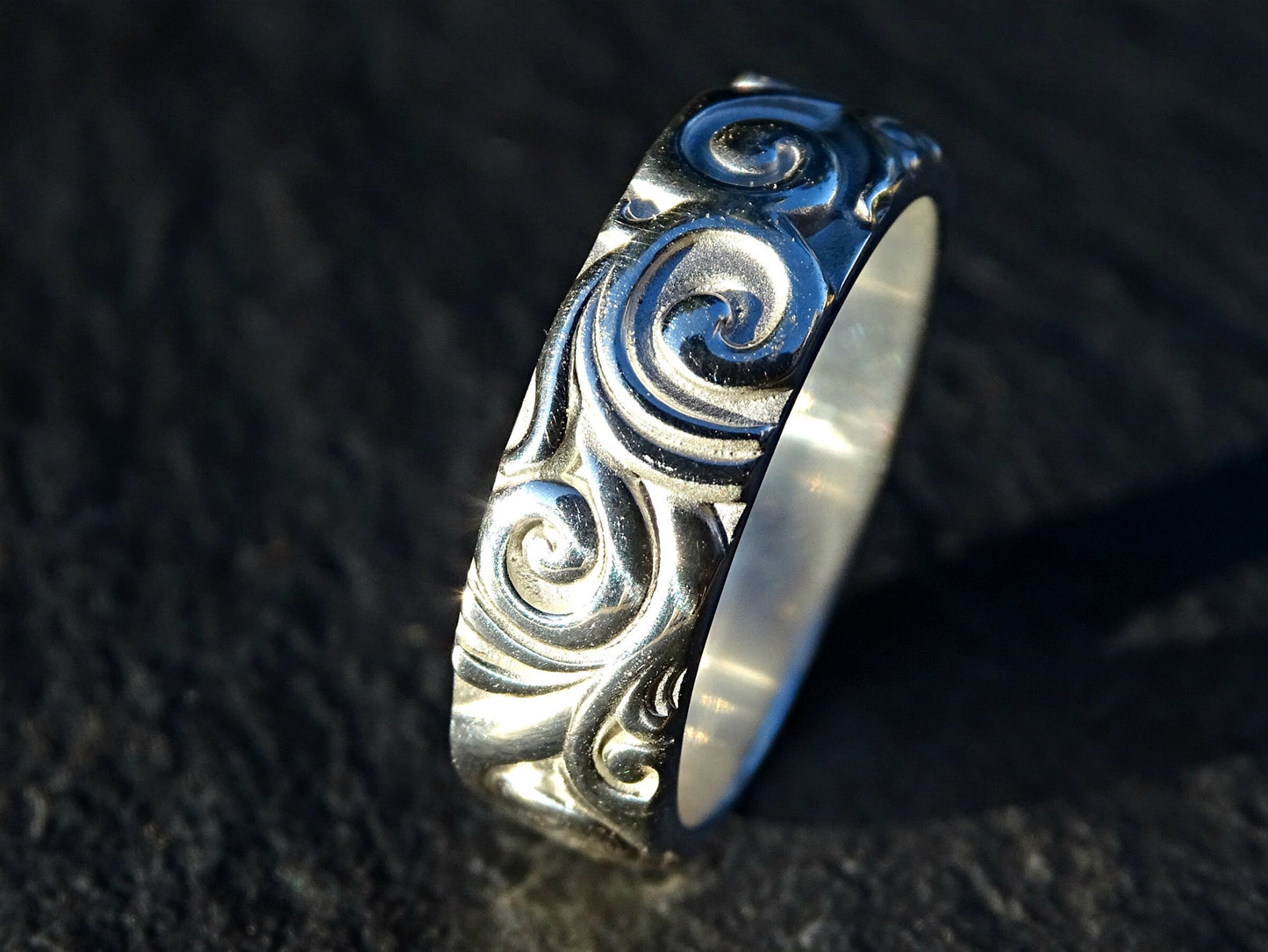 Unusual silver ring with carved scroll and swirl pattern, 6mm wide sterling silver band with deep dimension and nature-inspired design.