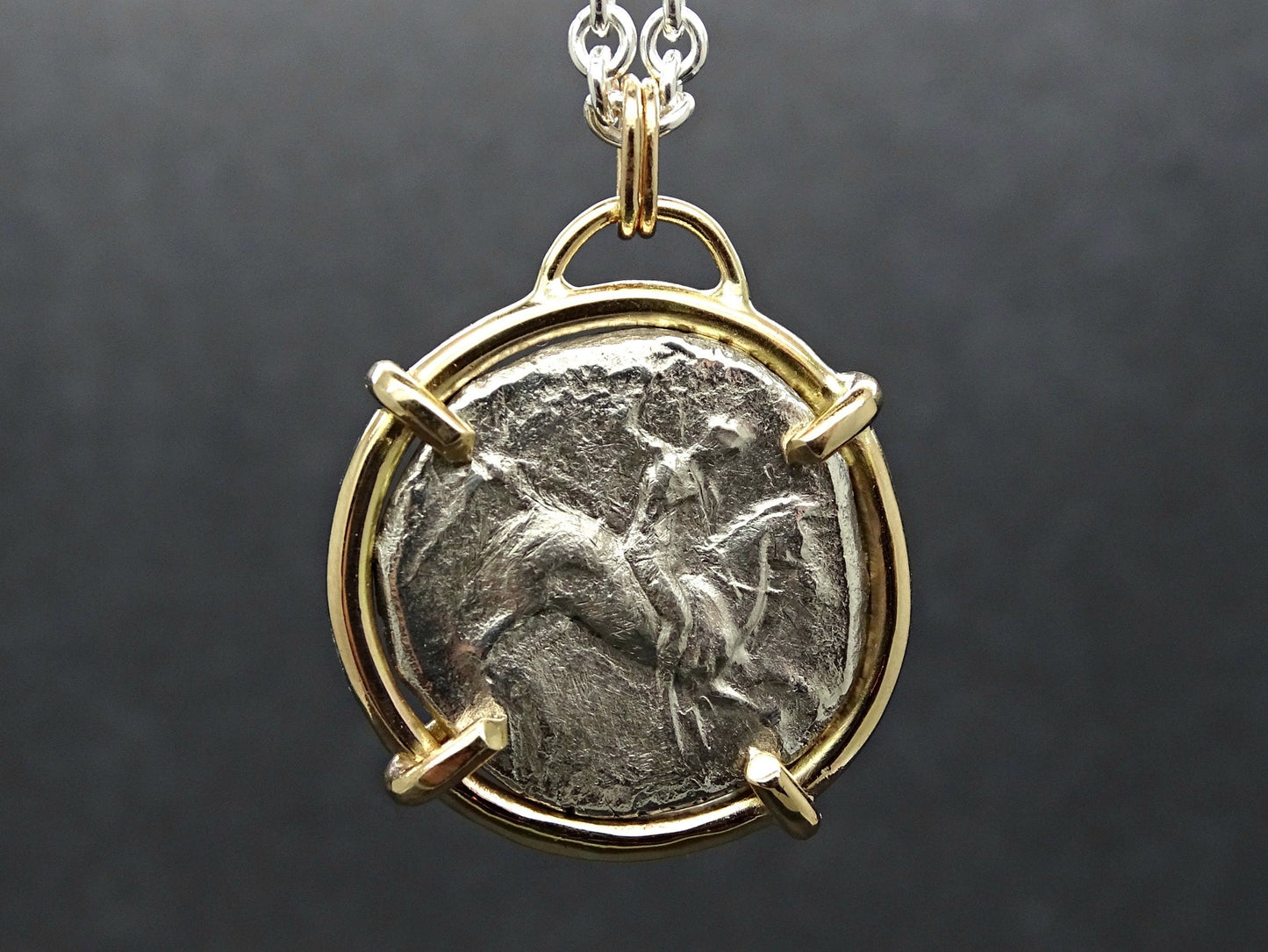 14k gold pendant featuring an authentic ancient silver coin from Calabria Tarentum with a boy on horseback design