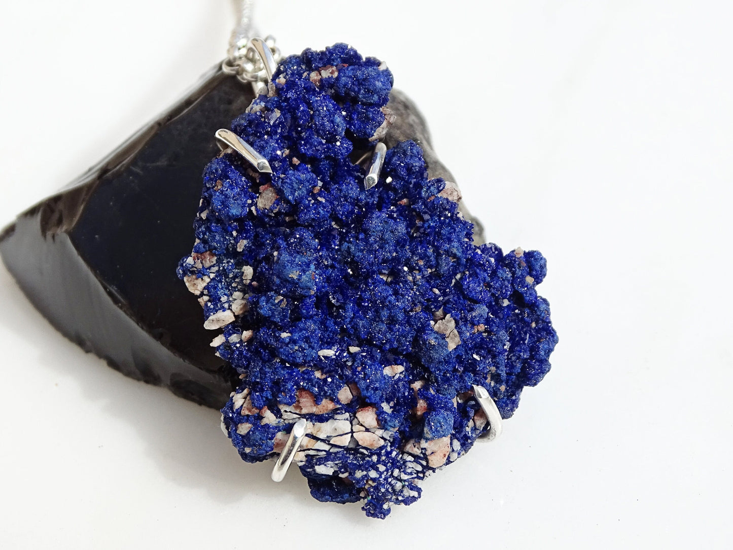 Sterling silver azurite crystal pendant with uncut midnight blue druzy cluster gemstone on white background