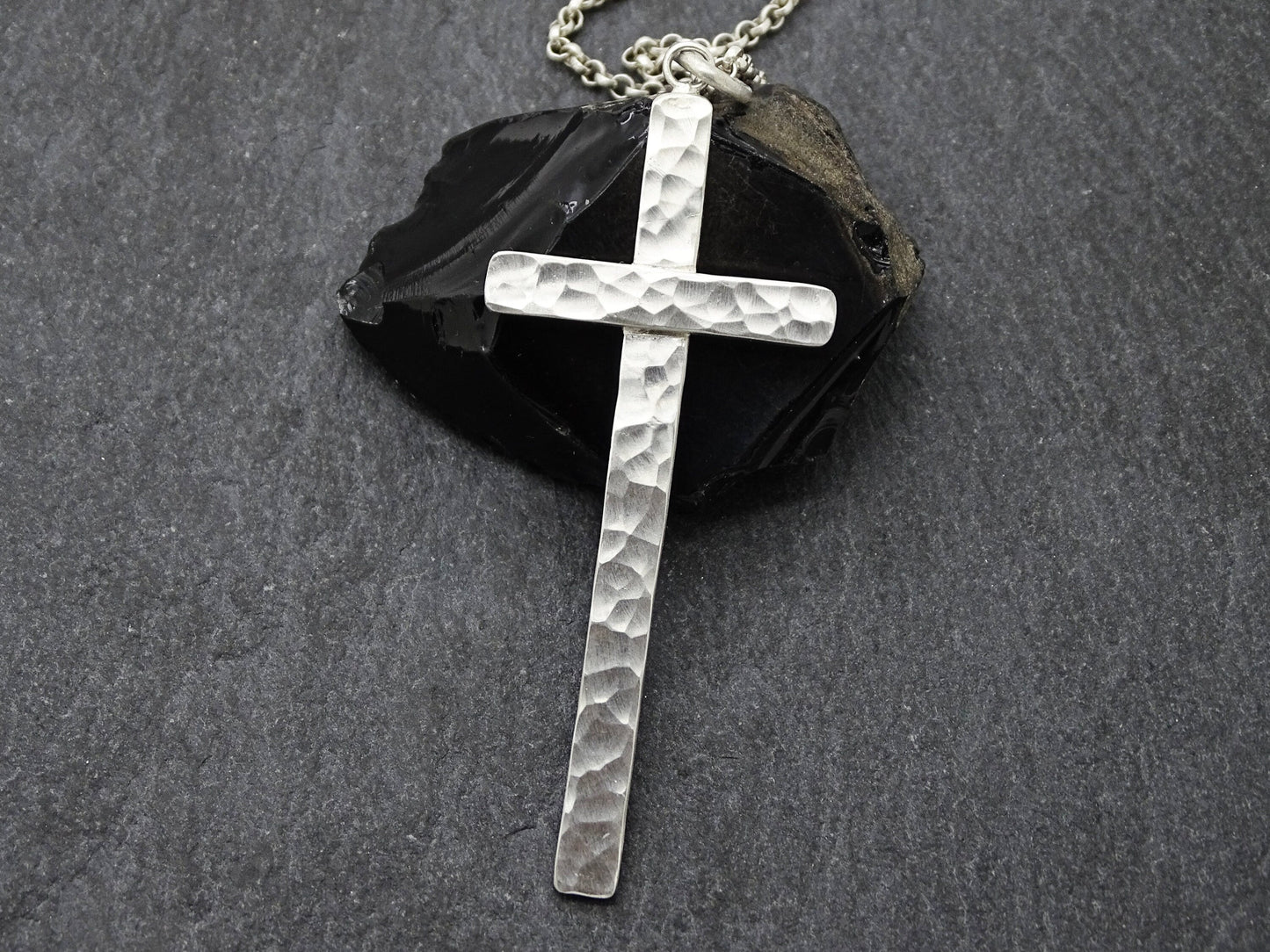 handmade hammered silver cross necklace on sterling silver chain with textured surface