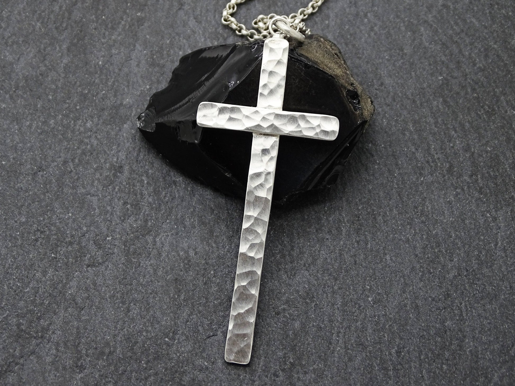 handmade hammered silver cross necklace on sterling silver chain with textured surface