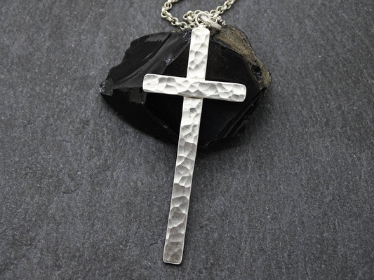handmade hammered silver cross necklace on sterling silver chain with textured surface