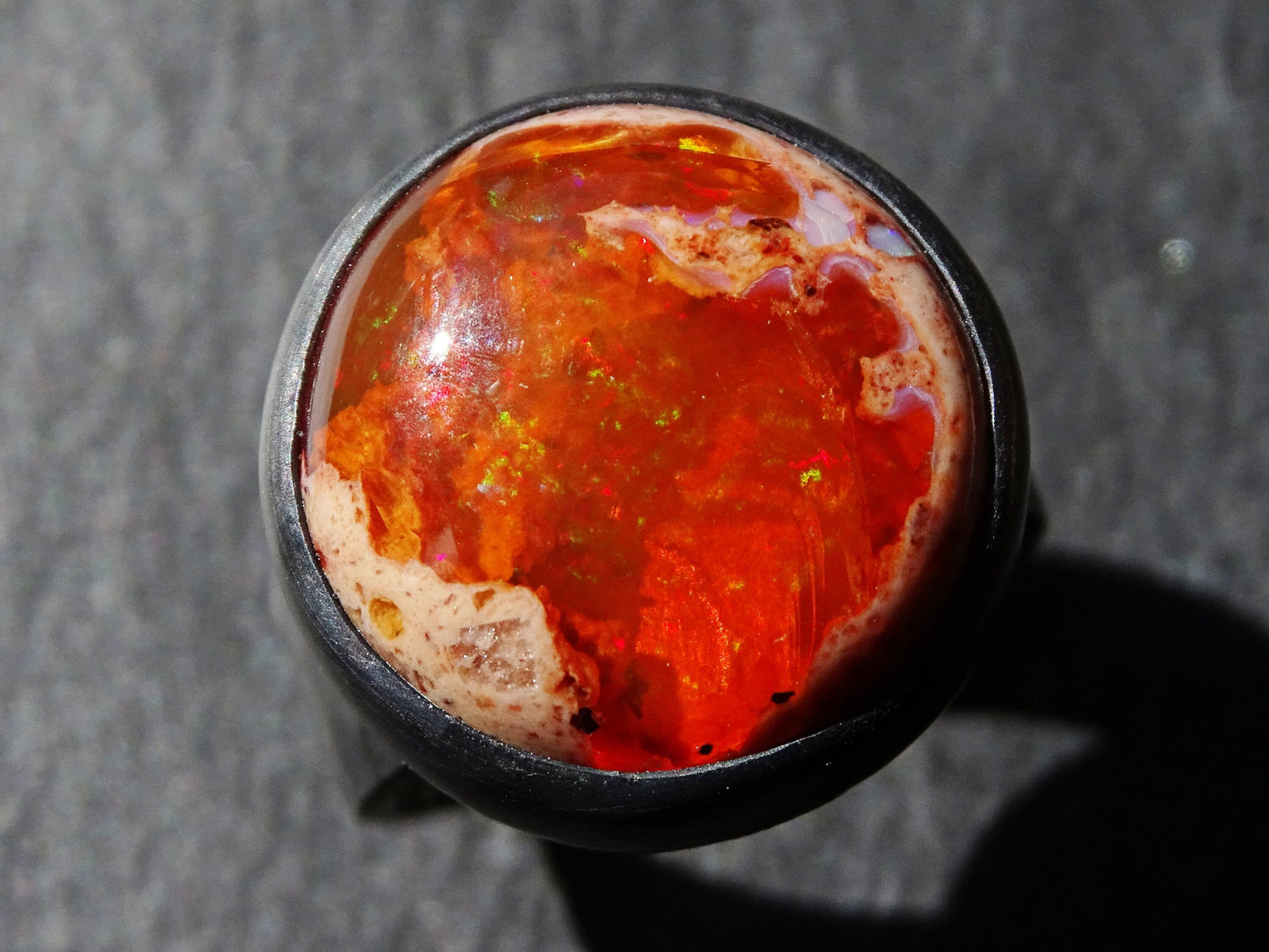 large orange fire opal ring with black oxidized sterling silver band size US 7 1/4