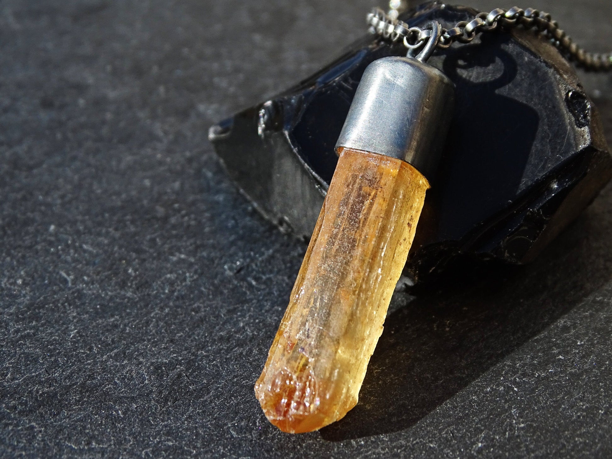 golden Imperial Topaz crystal pendant in black oxidized sterling silver setting with natural faceted crystal point