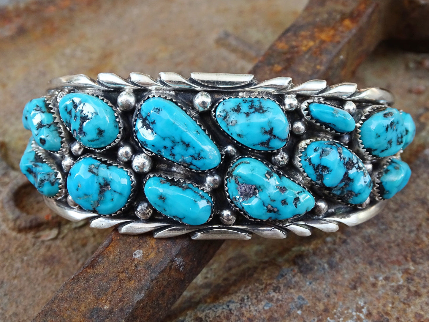 Native American Zuni turquoise cuff bracelet with 20 Kingman turquoise cabochons in sterling silver