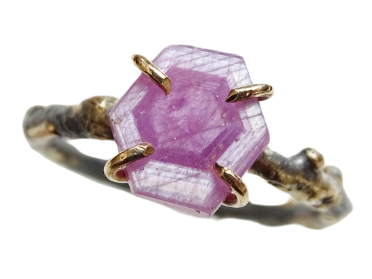 Trapiche ruby ring set with 14k gold prongs and dark silver band featuring unique hexagon pink sapphire gemstone