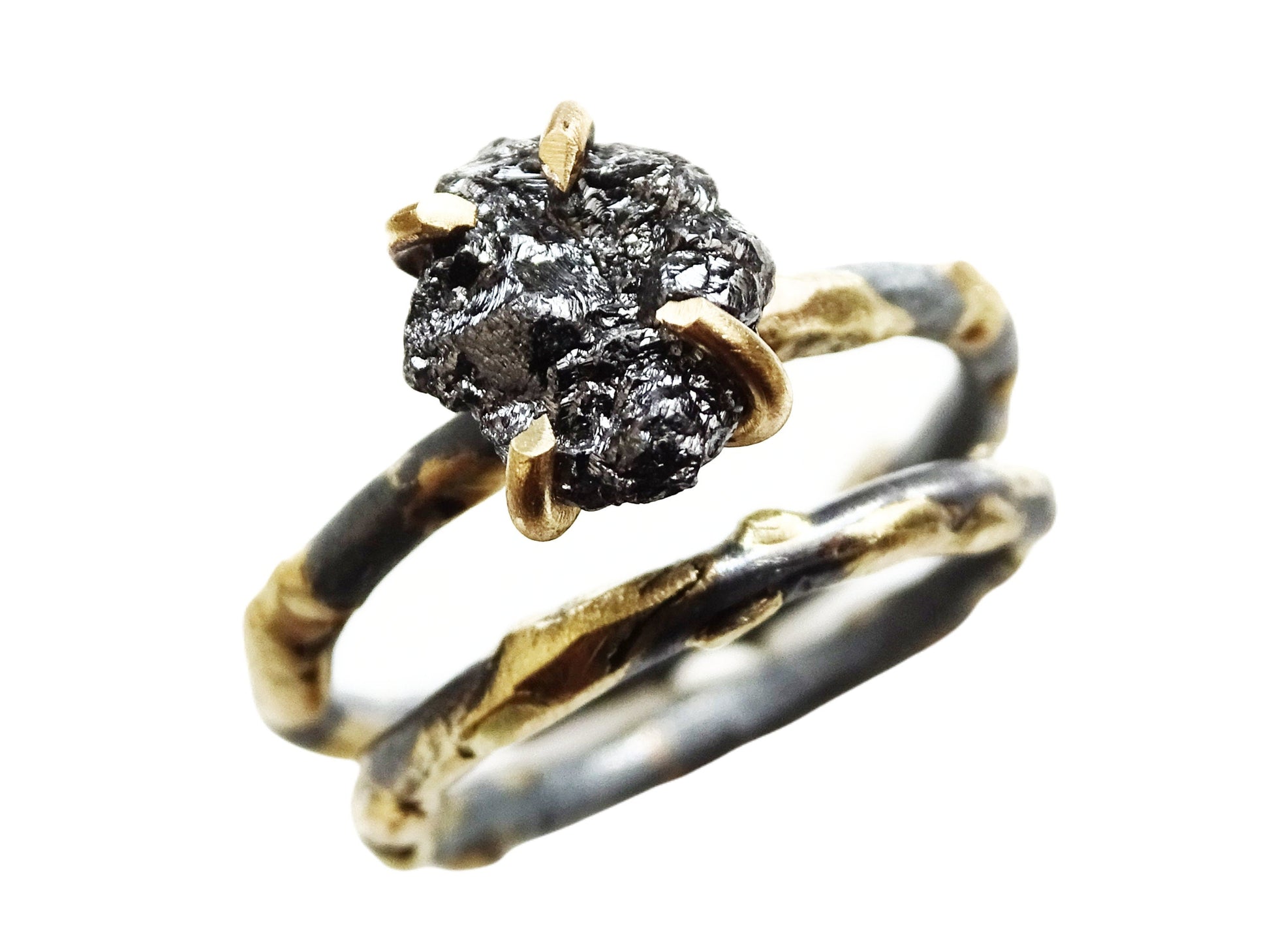 Viking style black diamond ring set in 14k gold and black silver with raw textured gemstone and gold prongs