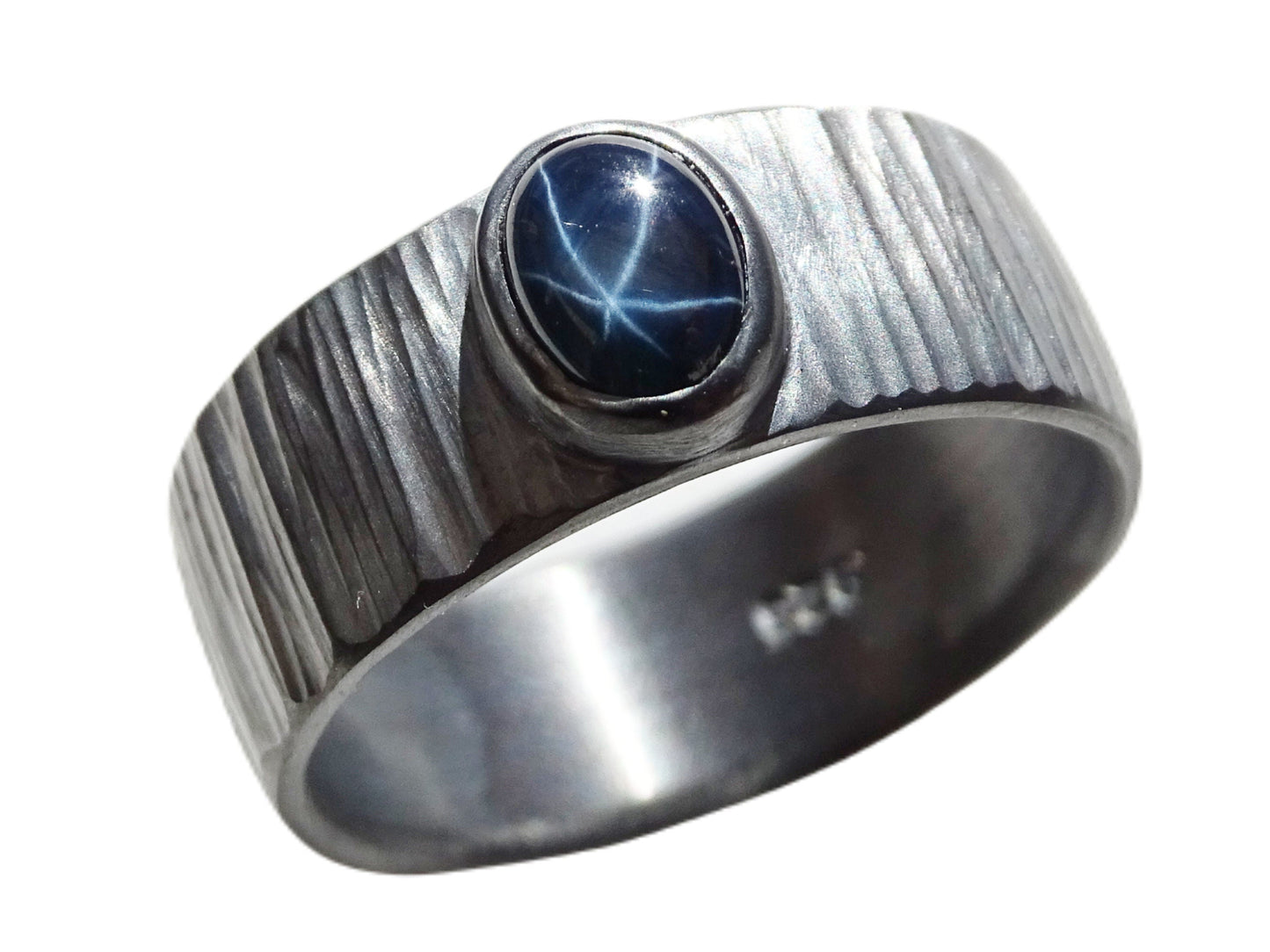 Dark oxidized sterling silver star sapphire ring with hammered texture and 8mm width