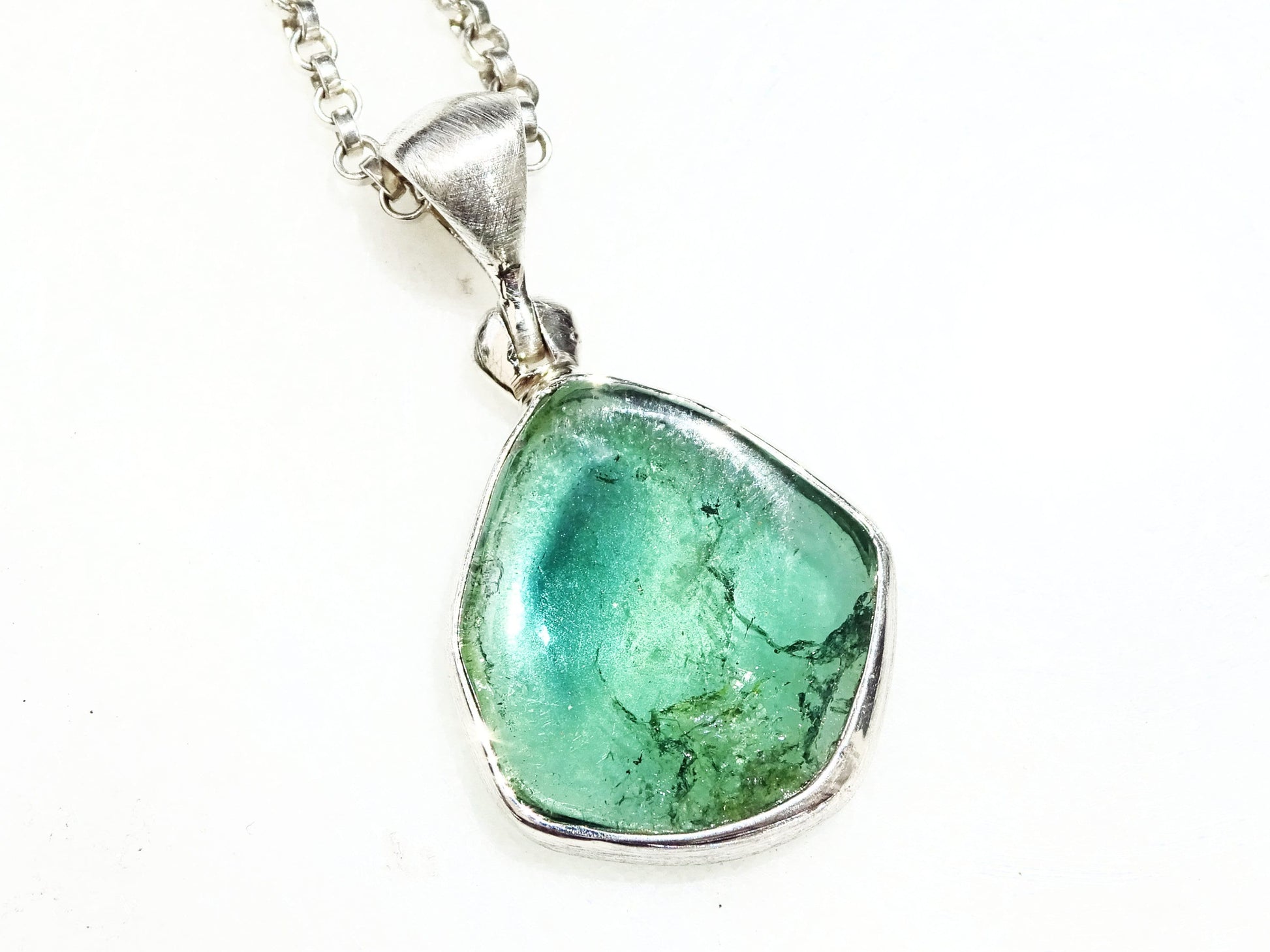 Blue green indicolite tourmaline crystal pendant set in sterling silver with chain
