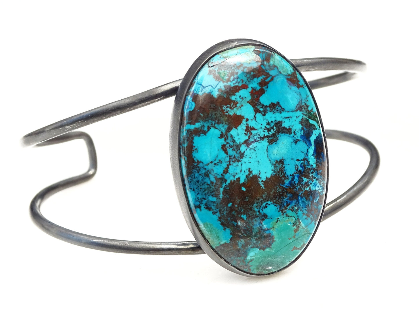 Sterling silver dark oxidized chrysocolla bracelet with oval turquoise stone in bezel setting