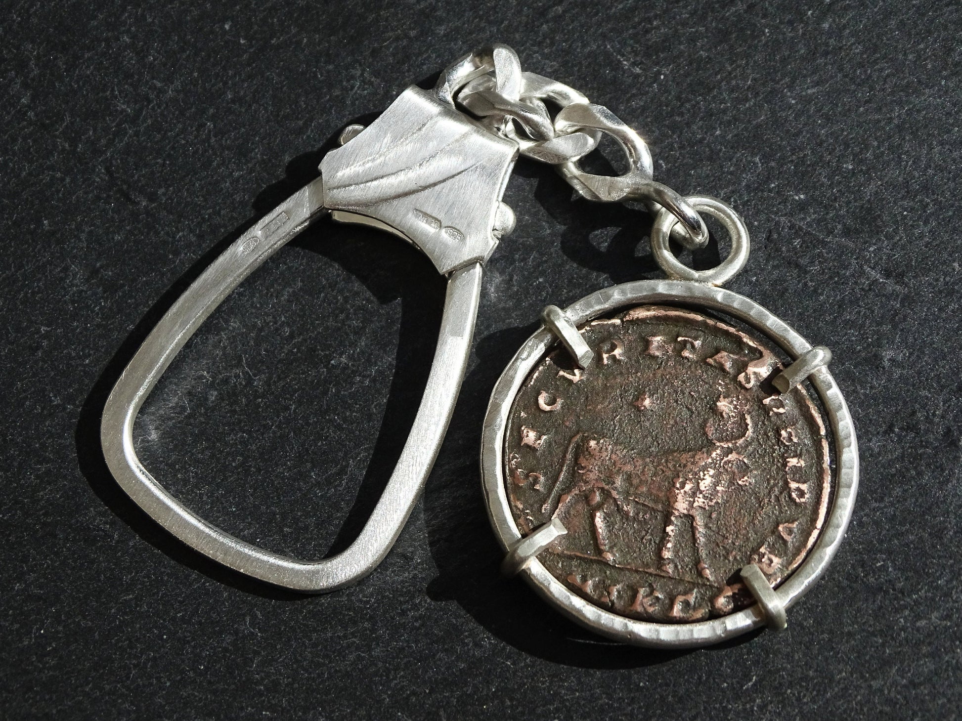 big silver key chain with ancient Roman Empire coin
