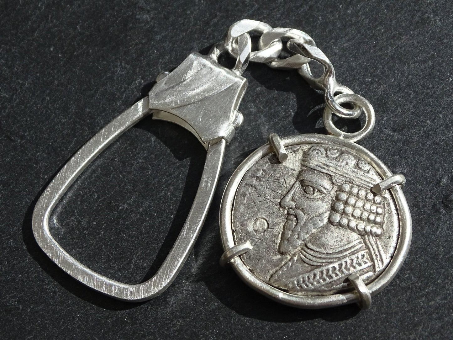 sterling silver keychain featuring an ancient Parthian coin with diademed bust of Gotarzes II in a four-prong matte silver setting