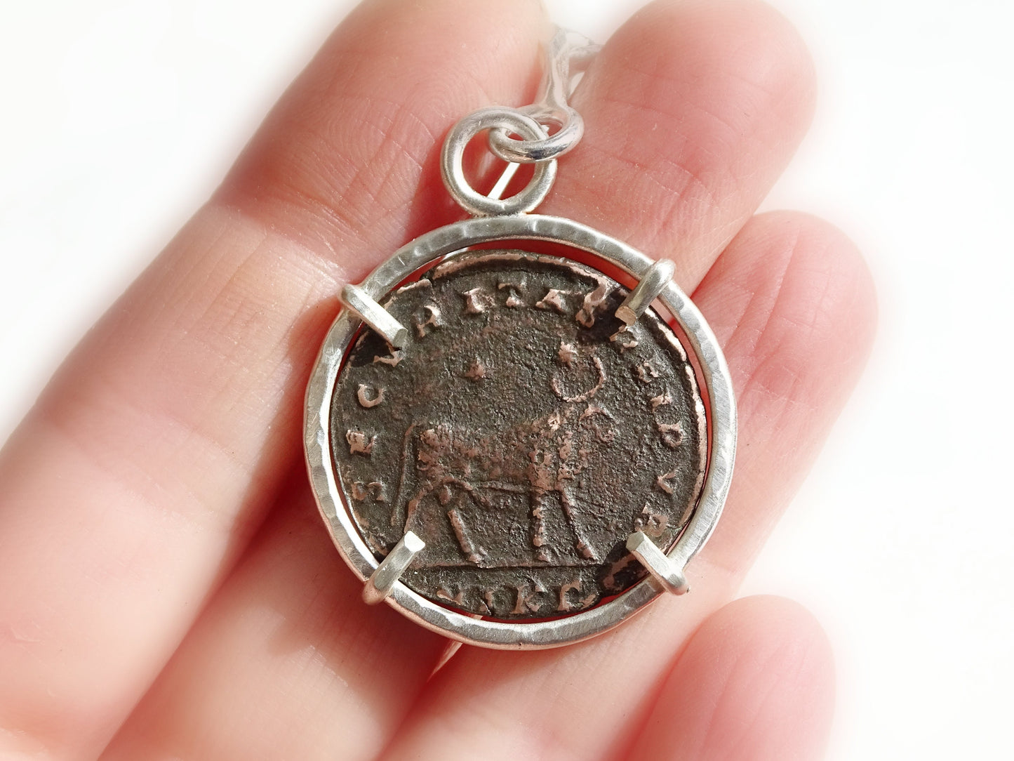 big silver key chain with ancient Roman Empire coin