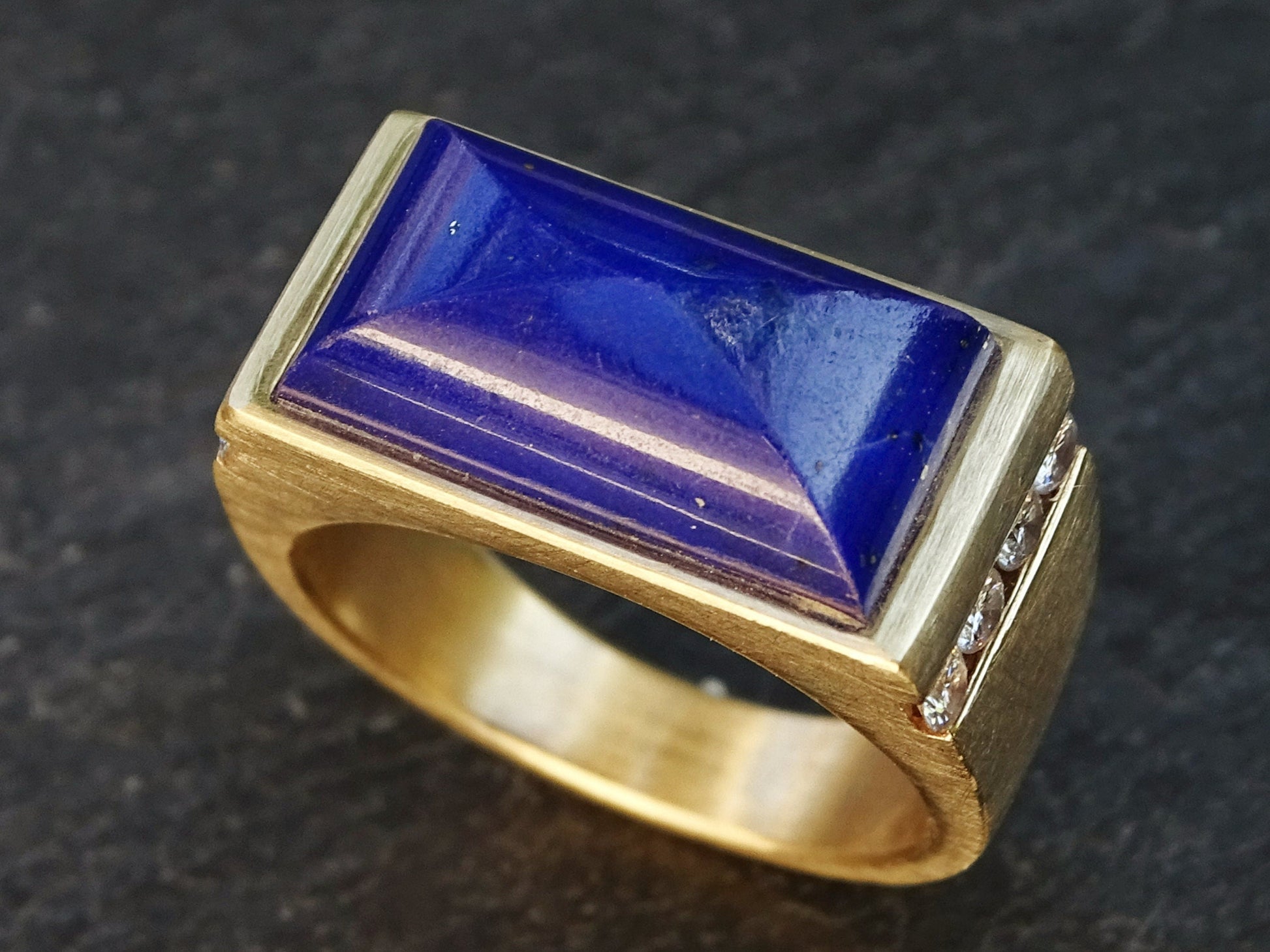 Large 14k gold lapis lazuli ring with channel set diamonds and a rectangular blue lapis lazuli centerpiece