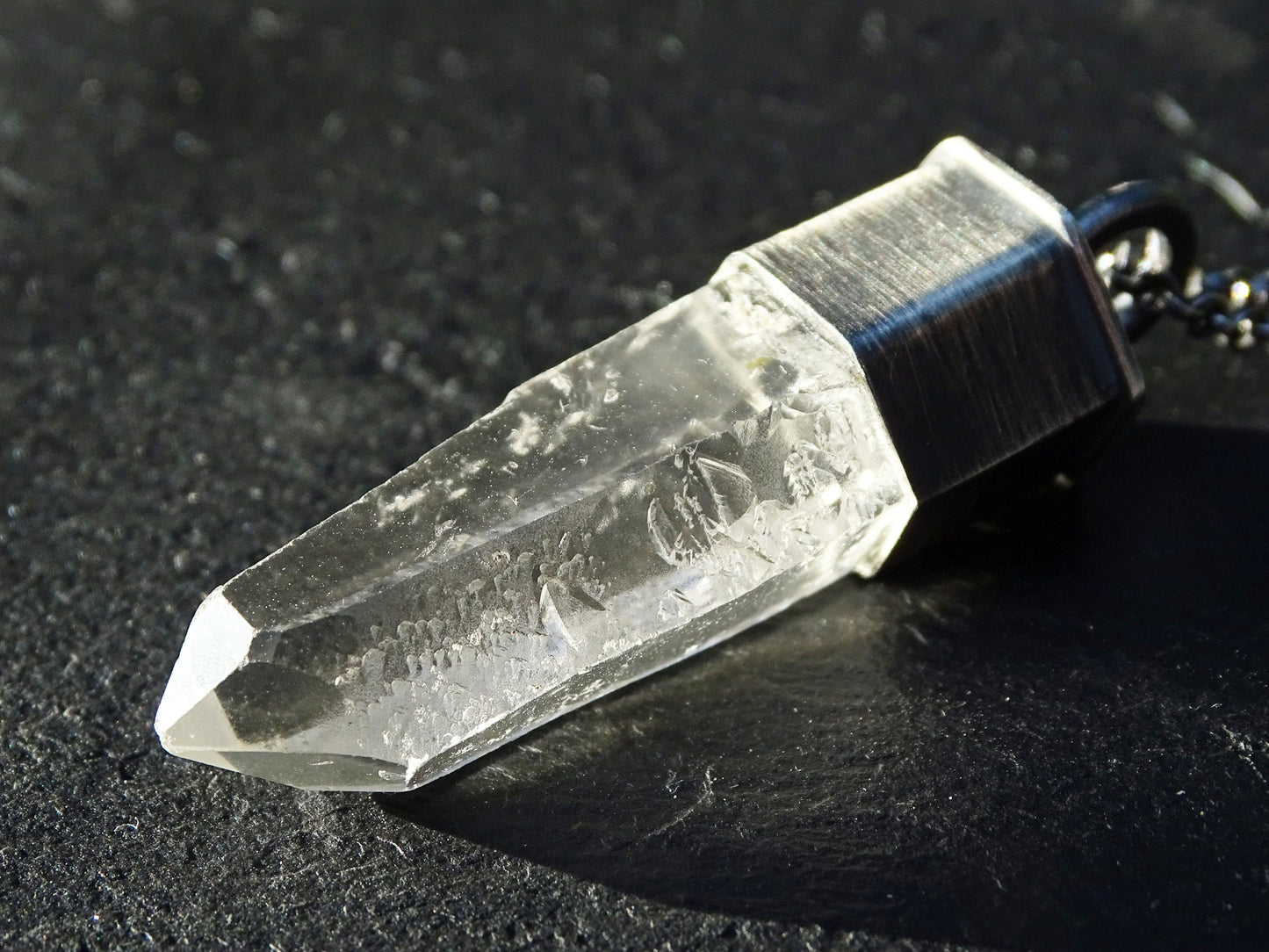 clear quartz crystal necklace pendant with black sterling silver chain and natural etched quartz point