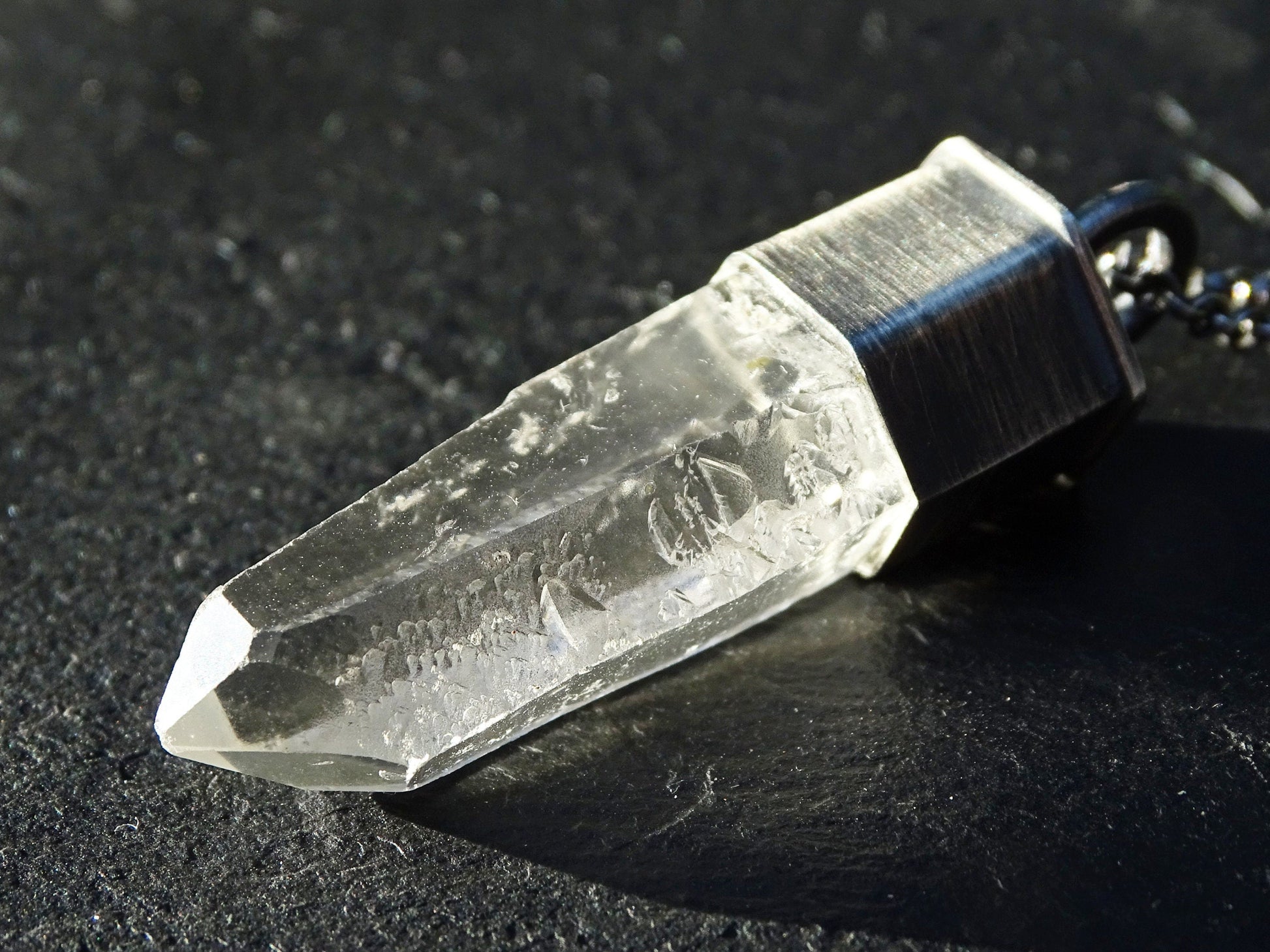 clear quartz crystal necklace pendant with black sterling silver chain and natural etched quartz point